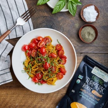 Brown Rice Pasta with Golden Paste-Cashew Sauce and Cherry Tomatoes