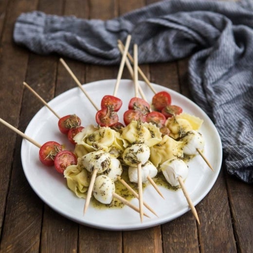 Tortellini Caprese Salad Skewers with Herb Vinaigrette Tortellini Caprese Salad Skewers with Herb Vinaigrette