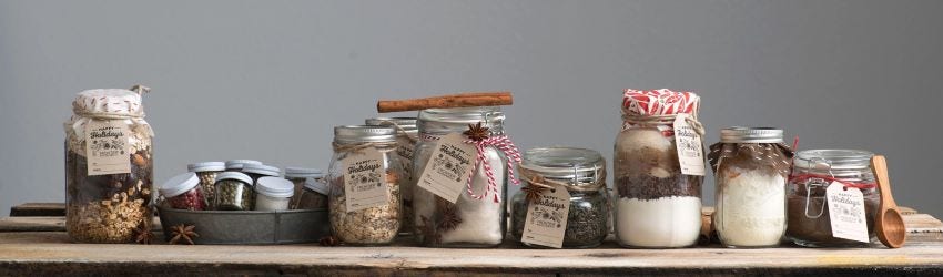 Organic spices in a glass container next to each other. Fair trade certified